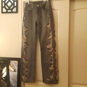 Mid-rise wide leg ripped jeans.